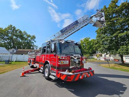 City of Arvin Ladder Fire Truck parked on a residential street.